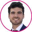 Headshot of a man with dark hair and facial hair wearing a suit and tie, shown inside a pink circular border on a white background, reflecting professionalism in the digital era.